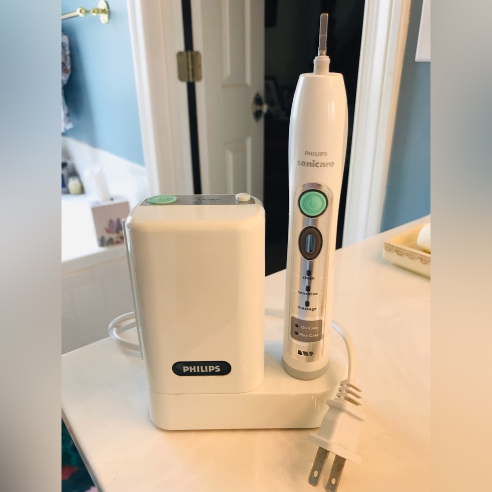 Phillips Sonicare Flexcare sonic toothbrush with sanitizer.
